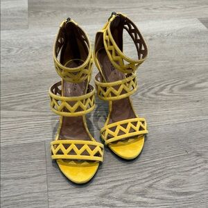 Alaïa yellow suede laser-cut ankle strap sandals